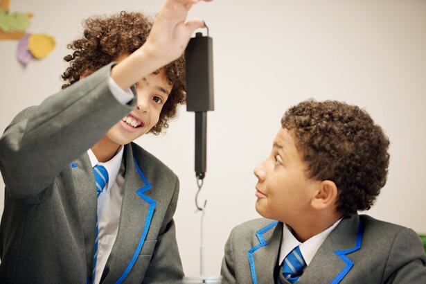 Picture of two boys measuring mass